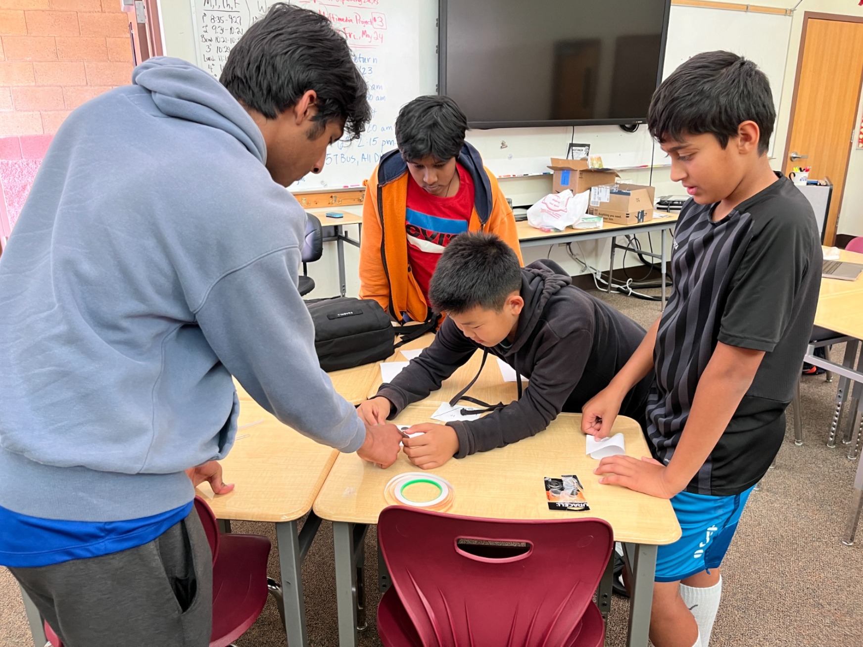 Students collaborating on hands-on engineering project